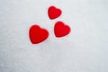 Three red heart shaped boxes laid on a snow background, with space for text. Concept for: love, family, diversity, offsprings Royalty Free Stock Photo
