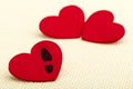 Three red hearts. Concept of broken heart and infidelity