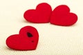 Three red hearts. Concept of broken heart and infidelity