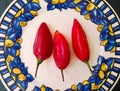 Three red jalapeno peppers, red hot chilli pepper. Isolated food ingredients. Royalty Free Stock Photo