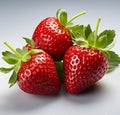 Three Red, Juicy Strawberries With Fresh, Vibrant Green Leaves Royalty Free Stock Photo