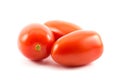 Three red long tomatoes on a white background Royalty Free Stock Photo