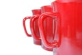 Three red mugs on white Royalty Free Stock Photo