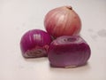 three red onions on a white background Royalty Free Stock Photo