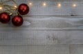 Three red ornaments for festive holiday Christmas concept gray background Royalty Free Stock Photo