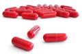 Three Red Pills (Capsules) with Many in Background Royalty Free Stock Photo