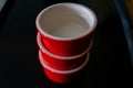 Three red ramekins stacked Royalty Free Stock Photo