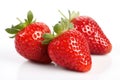 Three red ripe fresh strawberries with strawberry leaves on isolated white background. Organic farm food, fresh market. Royalty Free Stock Photo