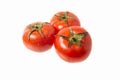 Three red ripe tomatoes on a white isolated background Royalty Free Stock Photo