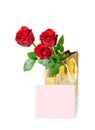 Three red roses in a golden gift bag and note card Royalty Free Stock Photo