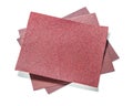 Three red sheet of abrasive paper isolated on white