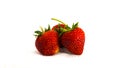 Three Red strawberries on tissue paper on white background Royalty Free Stock Photo