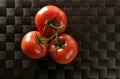 Three red tomatoes branch Royalty Free Stock Photo