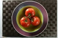 Three red tomatoes branch Royalty Free Stock Photo