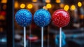 Three red white and blue cake pops on a stick Royalty Free Stock Photo
