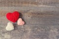 Three Red, white, pink thread heart on dark wooden vintage background. Handmade pretty heart. Love, romance, Valentines Royalty Free Stock Photo