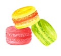 Three red, yellow and green colored almond macarons filled different creams