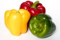 Three Red, Yellow, Green Peppers isolated on white background Royalty Free Stock Photo