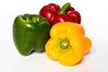 Three Red, Yellow, Green Peppers isolated on white background Royalty Free Stock Photo