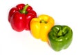 Three Red, Yellow, Green Peppers isolated on white background Royalty Free Stock Photo