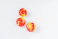 Three red yellow marbles on white Royalty Free Stock Photo