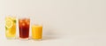 Three refreshing drinks including lemon, iced tea, and orange juice, with white background Royalty Free Stock Photo