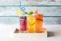 Three refreshing seltzers with various fruit garnishments. Royalty Free Stock Photo