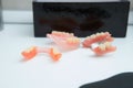 Removable metal partial denture on a white table Royalty Free Stock Photo