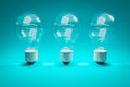 three retro style lightbulbs with glowing filament standing in a row on infinite colorful background creativity design concept