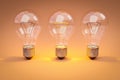 three retro style lightbulbs with glowing filament standing in a row on infinite colorful background creativity design concept