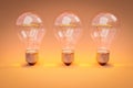 three retro style lightbulbs with glowing filament standing in a row on infinite colorful orange background creativity design