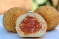 Three rice dumplings filled with minced meat sauce, called Sicilian Royalty Free Stock Photo