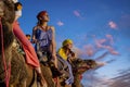 Three Riders And Their Handler Travel Through The Saharan Desert On Their Camels In Morocco Royalty Free Stock Photo