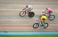 Three Riders on Velodrome Track