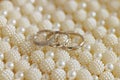 Three rings, pearls, church engagement symbol. Royalty Free Stock Photo