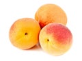 Three ripe apricots on white Royalty Free Stock Photo