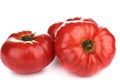 Three ripe big tomatoes with water drops isolated on white background Royalty Free Stock Photo