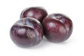 Three ripe black plums isolated Royalty Free Stock Photo