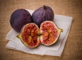 Three ripe figs on baking paper background Royalty Free Stock Photo