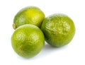 Three ripe limes in a bunch isolated on white background Royalty Free Stock Photo
