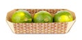 Three ripe limes in cardboard container isolated on white background Royalty Free Stock Photo