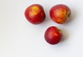 Three ripe nectarine fruits isolated on white background copy space. Healthy food Royalty Free Stock Photo