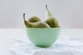 Three ripe pears in green porcalain bowl Royalty Free Stock Photo