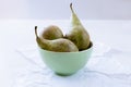 Three ripe pears in green porcalain bowl Royalty Free Stock Photo