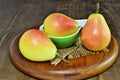 Three ripe pears over wooden board. Santa Maria Pears Royalty Free Stock Photo