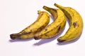 Three ripe plantains on a table