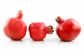 Three Ripe Pomegranates Fruits in Raw Isolated Royalty Free Stock Photo