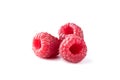 Three ripe raspberry fruits isolated on white background