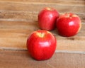 Three ripe red apples