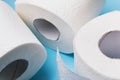 Three rolls of toilet paper on a blue background Royalty Free Stock Photo